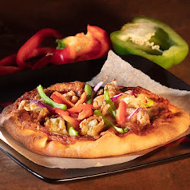 Butter Chicken Naan Pizza.
